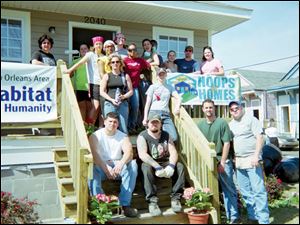 The Lourdes College Habitat for Humanity Alternative Spring Break team in front of the house they worked on in New Orleans after Hurricane Katrina.
