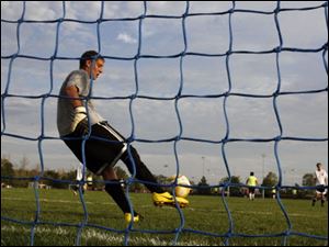 Nathan Bartlett, 15, of Sylvania Northview defends the goal Tuesday, 07/20/10, during the The Pacesetter Soccer Club week-long camp in Sylvania. 