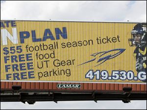 Springfield graduate Eric Page is featured on billboards promoting Toledo season tickets. Last season, he led all freshmen nationally with 82 catches and 1,159 receiving yards. He is one of 11 area players on UT's roster. 