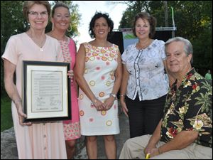 From left are Alliene Liden; Linsey Ansberg, ParTee on the Green chairman; Rita Mansour, Toledo Children's Hospital Foundation board chairman; Molly Long, Toledo Children's Foundation executive director; and Larry Peterson, chairman of the ProMedica Health System board of trustees.
