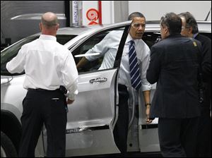 President Obama addresses workers at Chrysler Group's Jefferson North plant, where he praised American workers for their role in the resurgence of the U.S. auto industry.