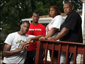 Whitmer standouts Nigel Hayes, left, and Kenny Hayes told their parents, Talaya and Al Davis, of Coach Bruce Smith's alleged behavior after Mrs. Davis met with other parents who made accusations against the coach.