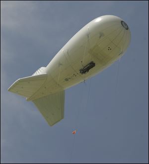 It's like a blimp, but it's unmanned and called an aerostat. The device, normally used for surveillance and communications, is tethered to a barge a half-mile from Maumee Bay State Park.