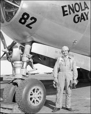 The B-29 Enola Gay provides the backdrop for the late Col. Paul Tibbets, who piloted the bomber 65 years ago today and dropped the atomic bomb dubbed 'Little Boy,' over Hiroshima, Japan. 