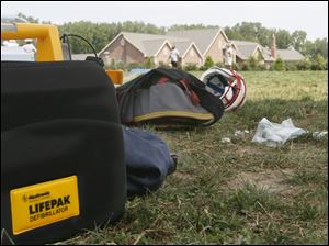 A defibrillator sits on the field at Bowsher High School. The device is kept on the sidelines at games and practices.
