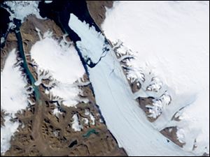 NASA A satellite image shows an ice island that separated from a glacier in northern Greenland. Scientists say it is the biggest in the Northern Hemisphere since 1962 and has the potential to reach the shipping lanes where the Titanic sank.