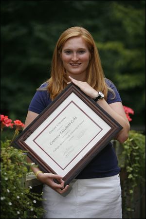 Courtney Cobb of Sylvania displays the certificate announcing she is a Fulbright scholarship winner.