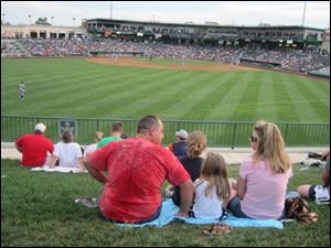 Families can enjoy minor league baseball games from inexpensive lawn seats at the new Parkview Field.