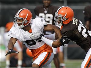 Cleveland rookie Joe Haden, right, defends wide receiver Chansi Stuckey during practice. The first-round pick from Florida has impressed the coaching staff.
