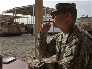 Staff Sgt. Lucas C. Trammell took part in the invasion of Iraq in 2003.  He is now on his fourth tour,  one of the 50,000 troops slated to remain in a noncombat role.
