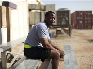 ‘The way I look at it, it's my job,' says  Staff Sgt. Trevino D. Lewis, dismissing the shifting rationales for the war that came and went over its seven-year duration.