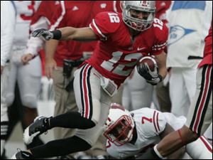 Ohio State's Dane Sanzenbacher picks up 17 yards and a first down on a pass reception during a Buckeyes' game against Wisconsin last season.