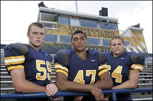 Whitmer's Chris Reaper, left, Chris Wormley and Andrew Maciolek hope to help the Panthers repeat their title in their  final season in the City League.