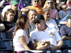 Actors Annabeth Gish, left, and Wayne Duvall rehearse a scene for the movie 'Home Run Showdown,' portions of which are being filmed at Fifth Third Field.