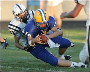 Northwood's Erik Russell, being tackled by Lakota's Jordan Harrison, scored on a 10-yard QB keeper in the second quarter.<br>
<img src=http://www.toledoblade.com/graphics/icons/photo.gif> <font color=red><b>VIEW GALLERY:</b></font> <a href=