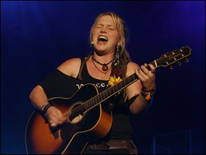 Crystal Bowersox performs one of her originals, ‘Holy Toledo,' during her emotional return home as part of the ‘American Idols Live!' at Huntington Center.