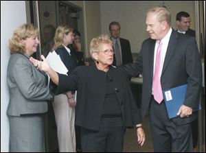 Carol Van Sickle of the Toledo Regional Chamber of Commerce talks with Ted Strickland during a recent campaign stop in the city by the Ohio governor.