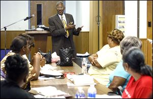The Rev. Lemuel Quinn III guides members of Southern Missionary Baptist Church in Bible study. 
