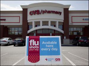 A CVS in Rockville, Md., promotes its flu shots. A record supply of vaccine for an all-in-one inoculation is expected.