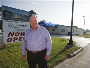 Hartie Spence, outside his Lake Charles, La., bank, says convincing regulators was demanding.