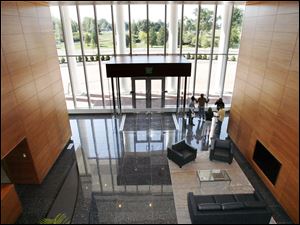 The grand staircase is gone, and granite and wood are featured in the two-story lobby to help the 95 employees take in the ambiance, officials said. 