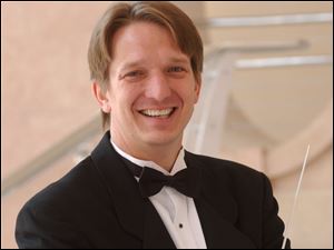 Resident conductor Jeffery Pollock conducts the Toledo Symphony Sept. 12 at Put-in-Bay.