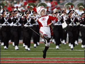 The Ohio State Marching Band takes the field in the Buckeyes' season opener in Columbus.