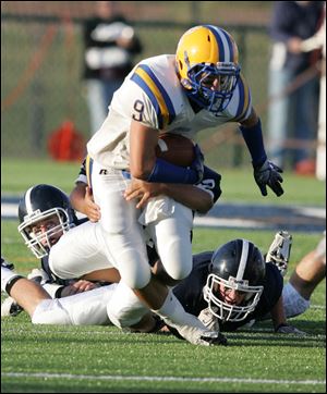 Northwood's Zach Bermejo powers his way through Lake's defense. He finished the game with 158 yards rushing and scored four touchdowns for the Rangers.<br>
<img src=http://www.toledoblade.com/graphics/icons/photo.gif> <font color=red><b>VIEW GALLERY:</b></font> <a href=