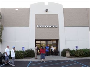 Faurecia Interior Systems in Northwood manufactures door panels for the Jeep Liberty and Dodge Nitro sport utility vehicles.