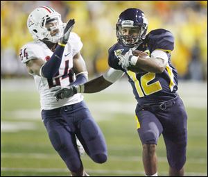 Toledo's Eric Page, being guarded by Arizona's Trevin Wade had just four catches for 43 yards against the Wildcats last Friday.
