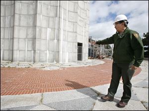 Jerry Cantu, facilities manager at Perry's Victory and International Peace Monument shows where a 500-pound piece of granite fell from the observation deck in June 2006. 