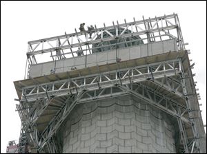 Workers' scaffolding surrounds the observation deck at Perry's Monument at Put-in-Bay, Ohio. The 197th anniversary of the battle is Friday.<br>
<img src=http://www.toledoblade.com/graphics/icons/photo.gif> <font color=red><b>VIEW GALLERY:</b></font> <a href="/apps/pbcs.dll/gallery?Avis=TO&Dato=20100909&Kategori=NEWS16&Lopenr=909009998&Ref=PH"> <b> Perry's Memorial Project</b></a> Sept. 8, 2010