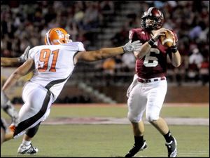 Bowling Green's Chris Jones (91) applies pressure to Troy University quarterback Corey Robinson during last Saturday's game at Troy. 