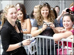 Toledo-area native Crystal Bowersox meets and greets fans outside the Huntington Center during the recent American Idol tour stop. 