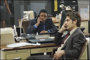 Jon Michael Hill, left, and Michael Imperioli are shown in a scene from the series, 'Detroit 1-8-7.' 