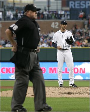 Home plate umpire Jim Joyce waits for Armando Galarraga to finish his warmup pitches. Friday night was the first time Joyce and Galarraga have been part of the same game since Galarraga's perfect game bid on June 2 was ended by a blown call at first base by Joyce in the ninth inning.