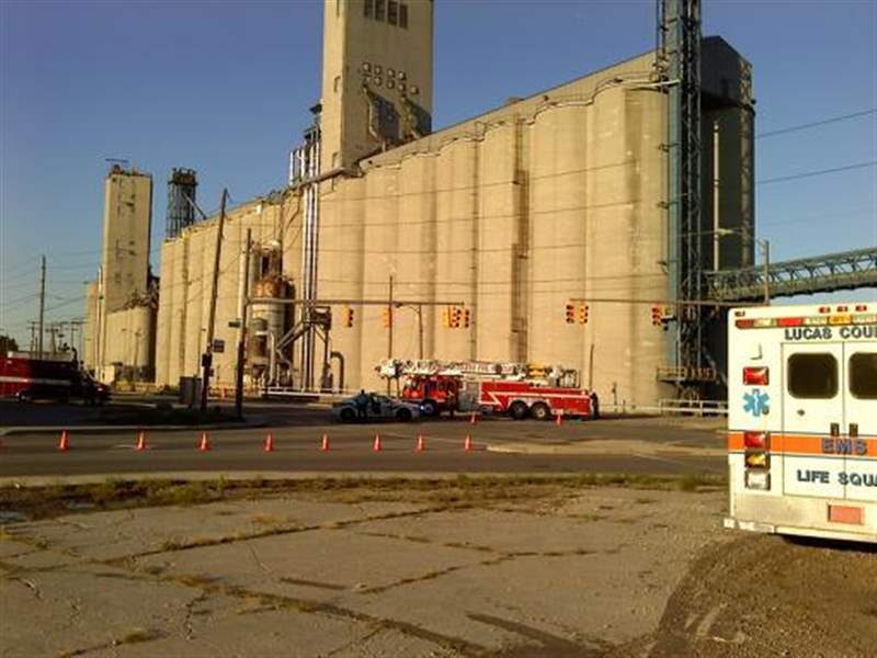 Fire crews break hole into grain elevator to douse fire; threat of