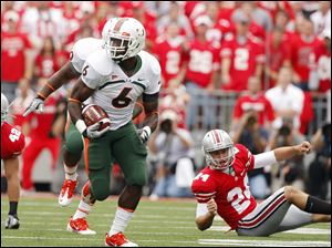 Miami's Lamar Miller returns a kickoff for a touchdown against Ohio State on Saturday.