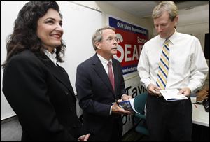 Mike DeWine, center, talks with Jon Stainbrook, Lucas County GOP chairman, as auditor candidate Gina-Marie Kaczala watches.