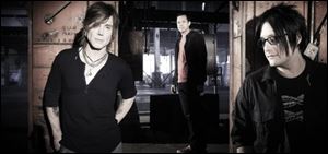 Johnny Rzeznik (vocals, guitar), Mike Malinin (drums) and Robby Tackacs (bass, vocals) make up the band The Goo Goo Dolls, who will perform Oct. 6 at Stranahan Theater.