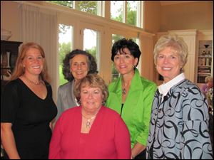 Sustainer members of the Junior League of Toledo include, from left, Becca Gorman, Bridget Holt, Jill Peterson (in red), Karen DeMain, and Martha Mewhort.