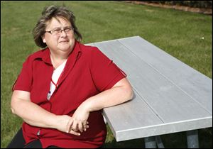 A government-funded retraining program helped Patricia Zuber finish her accounting degree after she lost her job, but she still makes $4 less an hour.