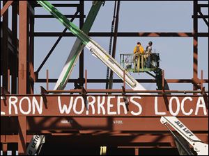 Spending in construction, exemplified by this Springfield, Ill., site, got a boost from government projects last month, offsetting weakness in the private sector, the Commerce Department said.