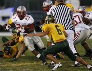 Central running back Calebb Goings darts around Clay's Nick Roman (6). Goings rushed for 137 yards and two touchdowns.<br>
<img src=http://www.toledoblade.com/graphics/icons/photo.gif> <font color=red><b>VIEW GALLERY:</b></font> <a href=