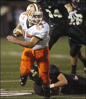Southview's Jay Fisher turns the corner to gain yardage against Perrysburg in Friday night's NLL showdown. 
