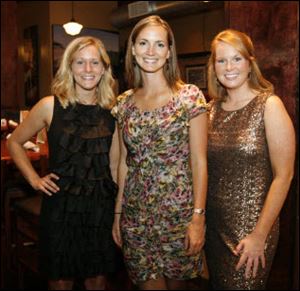 Mandy Sinclair, left, Jessie Daniel, center, and Lisa Hummel wear clothes from Sophie's Sister.