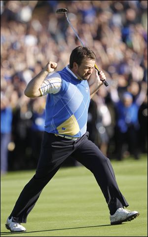 Graeme McDowell pumps his fists after a key birdie putt on the 16th hole at Celtic Manor in Wales. He defeated American Hunter Mahan to clinch the Ryder Cup for the European squad.