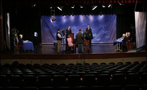 The U.S. Senate candidates receive instructions from debate moderator Diane Larson of WTVG, Channel 13, left. The debate at Bowsher High School was not open to the public.
