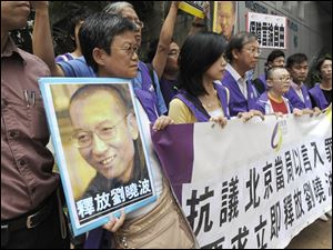 Pro-democracy protesters in Hong Kong call for the release of Liu Xiaobo, who is in the second of 11 years of imprisonment for urging freedom of speech, religion, and assembly in China.