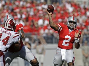 Ohio State's Terrelle Pryor  throws a pass against Indiana during the first quarter of an NCAA college football game Saturday in Columbus.